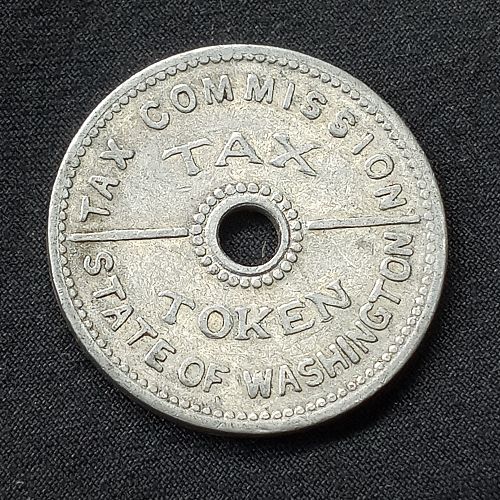 1935 WASHINGTON STATE 10c TAX TOKEN.THIS YEAR TELL THE TAX MAN YOU'LL PAY WITH THIS