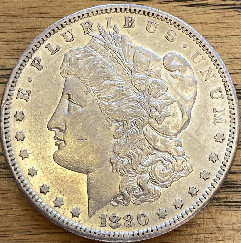 1880S Morgan dollar in ALMOST UNCIRCULATED 58 condition