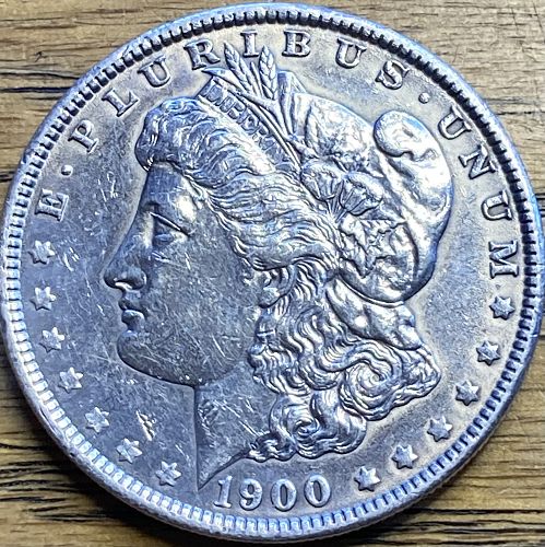 1900 Morgan dollar in ALMOST UNCIRCULATED condition