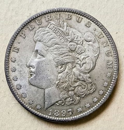 1897 O Morgan Silver Dollar • .900 Silver • Better Date • Nice Toning • AU