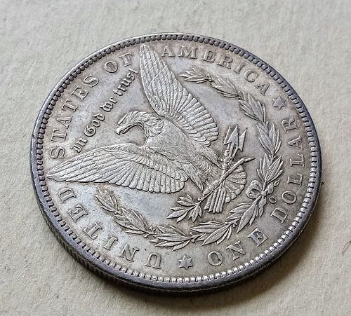 1897 O Morgan Silver Dollar • .900 Silver • Better Date • Nice Toning • AU