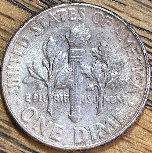 1957 Roosevelt dime in ALMOST UNCIRCULATED condition