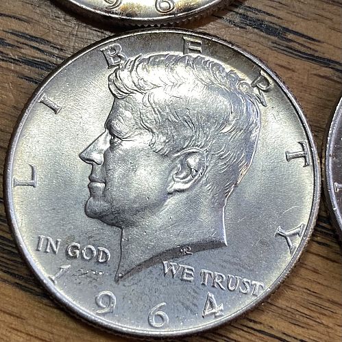 4 1964 Kennedy half dollars in ALMOST UNCIRCULATED-MINT STATE condition