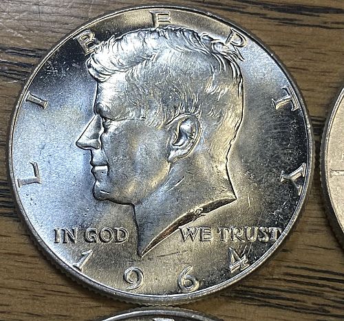 4 1964 Kennedy half dollars in MINT STATE condition