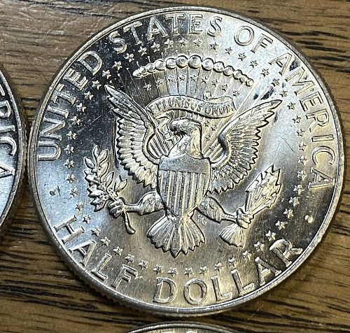 4 1964 Kennedy half dollars in MINT STATE condition