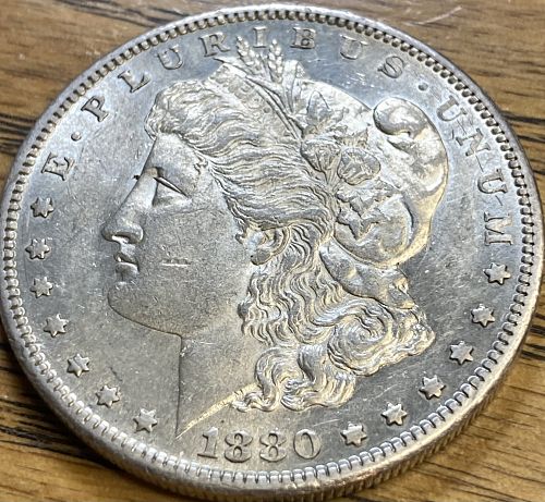 1880S Morgan dollar in ALMOST UNCIRCULATED 58 condition