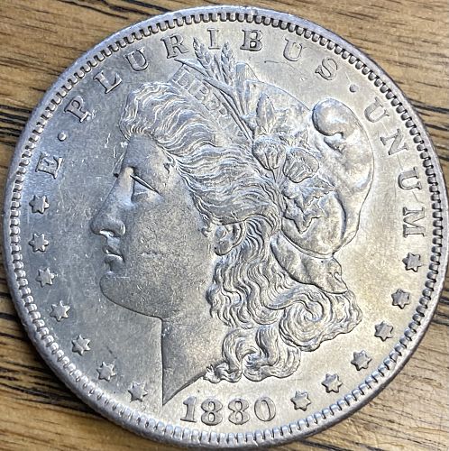 1880S Morgan dollar in ALMOST UNCIRCULATED 58 condition