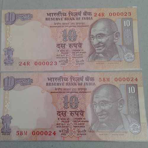 000023   and 24 . .INDIA UNC PAIR