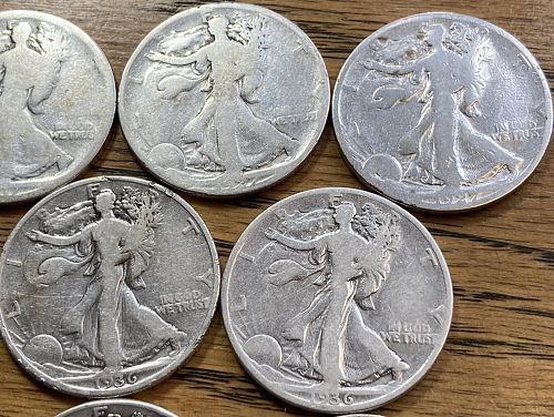 Half roll of $5.00 FV walking liberty halves some better dates but worn