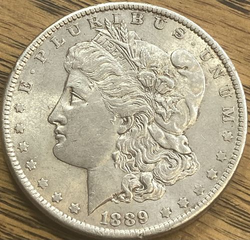 1889 Morgan dollar in ALMOST UNCIRCULATED condition