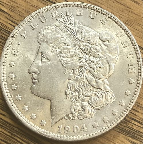 1904O Morgan dollar in ALMOST UNCIRCULATED condition