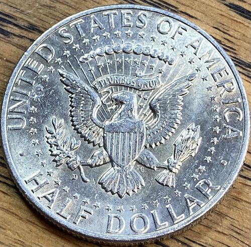 1964D Kennedy half in ALMOST UNCIRCULATED condition