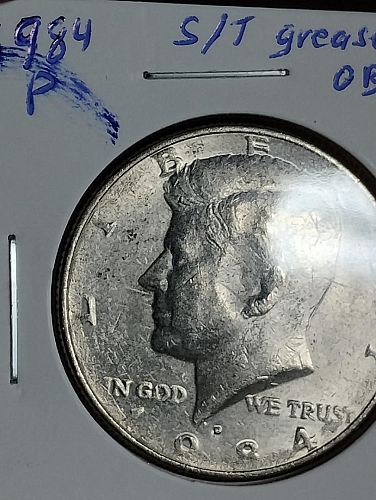 1984-P KENNEDY HALF DOLLAR STRUCK THROUGH GREASE OBVERSE & REVERSE ERROR COIN