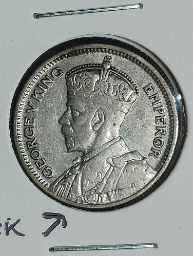 1934 NEW ZEALAND SIX PENCE XF-40 WITH LARGE RIM TO RIM DIE CRACK ON OBVERSE ERROR