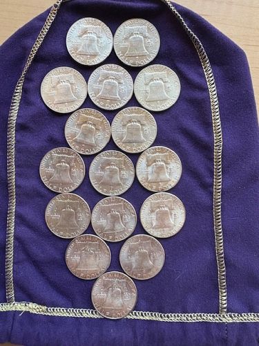 Lot of (16) Franklin Half Dollars. AU or Better