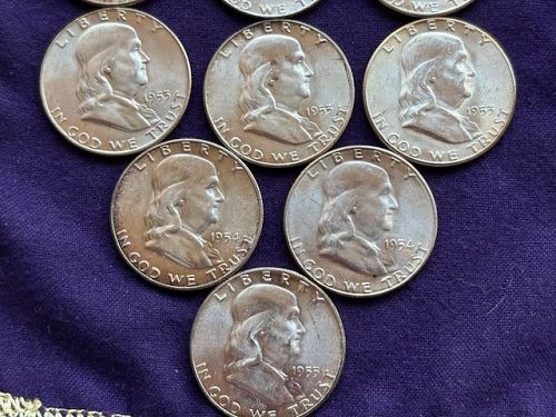 Lot of (16) Franklin Half Dollars. AU or Better
