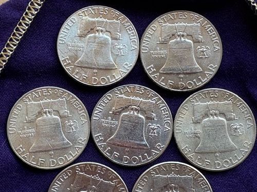 Lot of (16) Franklin Half Dollars. AU or Better