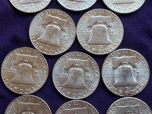 Lot of (16) Franklin Half Dollars. AU or Better