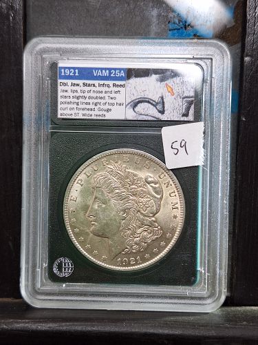 1921 P Morgan silver dollar. Top 100 Vam 25A lightly cleaned obverse