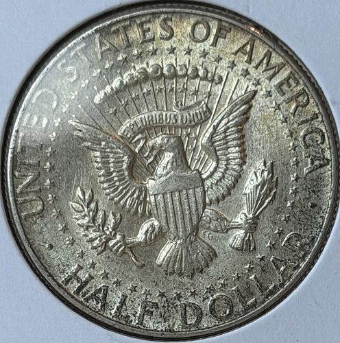 1964-P Kennedy 90% Silver Half Dollar &bull; Toned AU/BU Condition