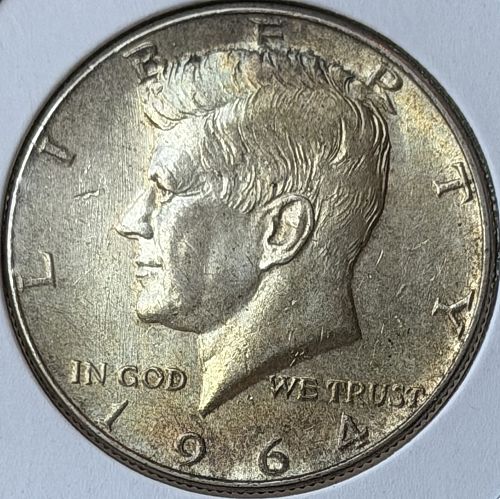 1964-P Kennedy 90% Silver Half Dollar &bull; Toned AU/BU Condition
