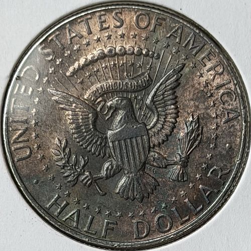 1964-P Kennedy 90% Silver Half Dollar &bull; Toned AU/BU Condition