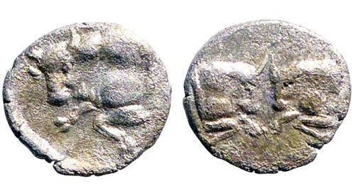 Caria, Uncertain mint. 5th century BC, AR 8mm .30gm hemiobol. Bull / Bull's