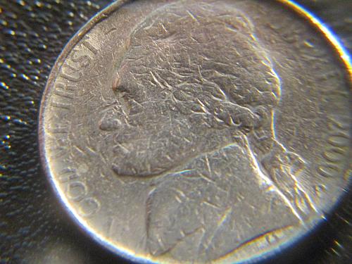 This coin appears to be struck over, or possible bad planchet / 5 cents is almos