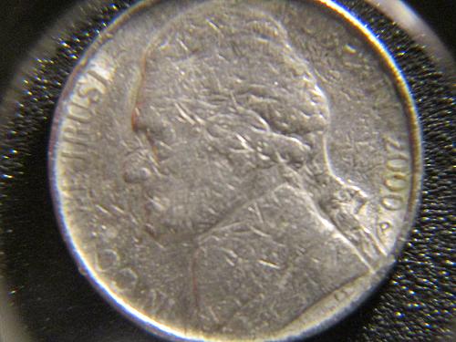 This coin appears to be struck over, or possible bad planchet / 5 cents is almos