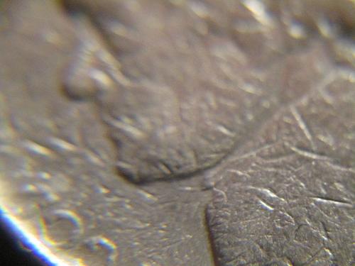 This coin appears to be struck over, or possible bad planchet / 5 cents is almos