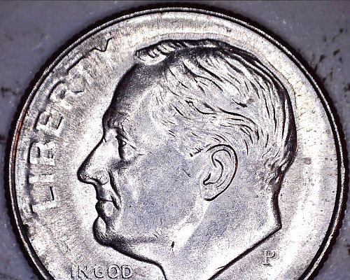 2015 P dime struck through a grease filled die
