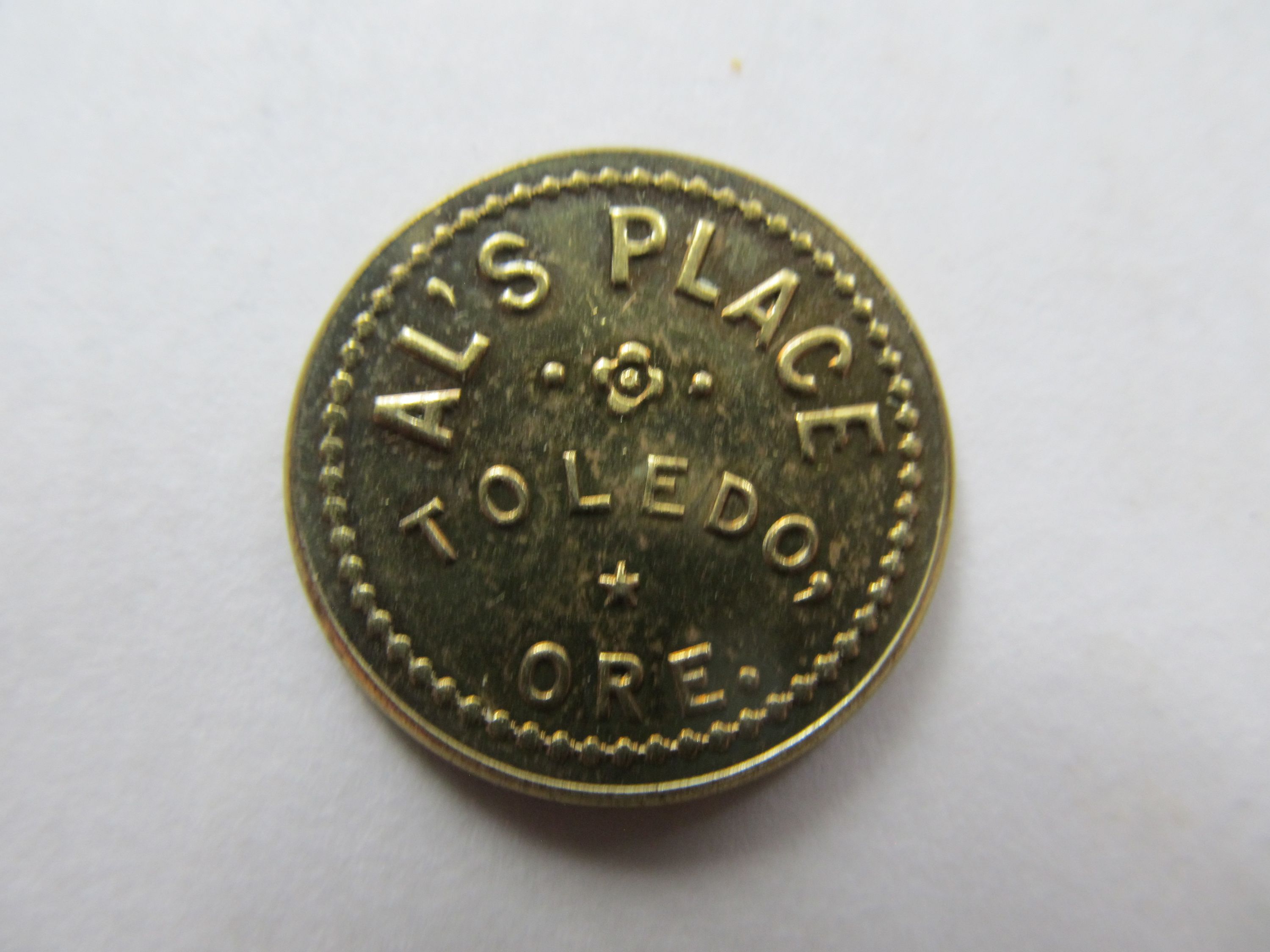 Al's Place trade token.